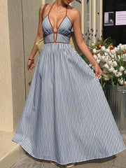 Blue striped halter maxi dress with plunging neckline and a-line skirt.