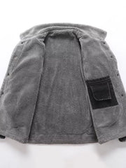 Gray sherpa-lined denim jacket interior with black chest pocket detail