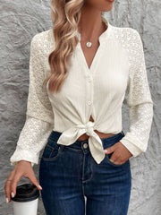 Cream lace sleeve raglan blouse with button front and tie knot detail