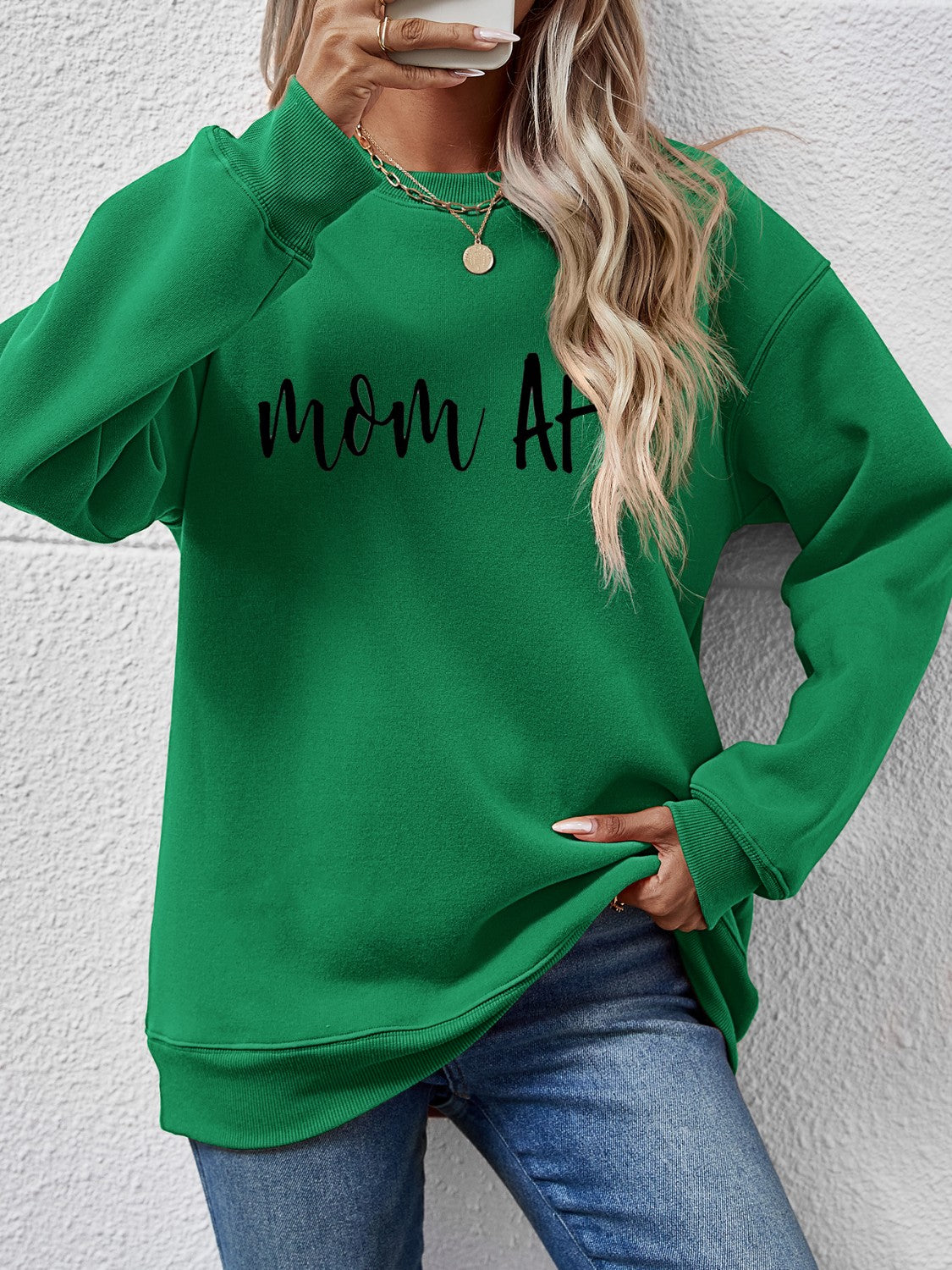 Green graphic sweatshirt with black "mom af" text, crewneck, long sleeves