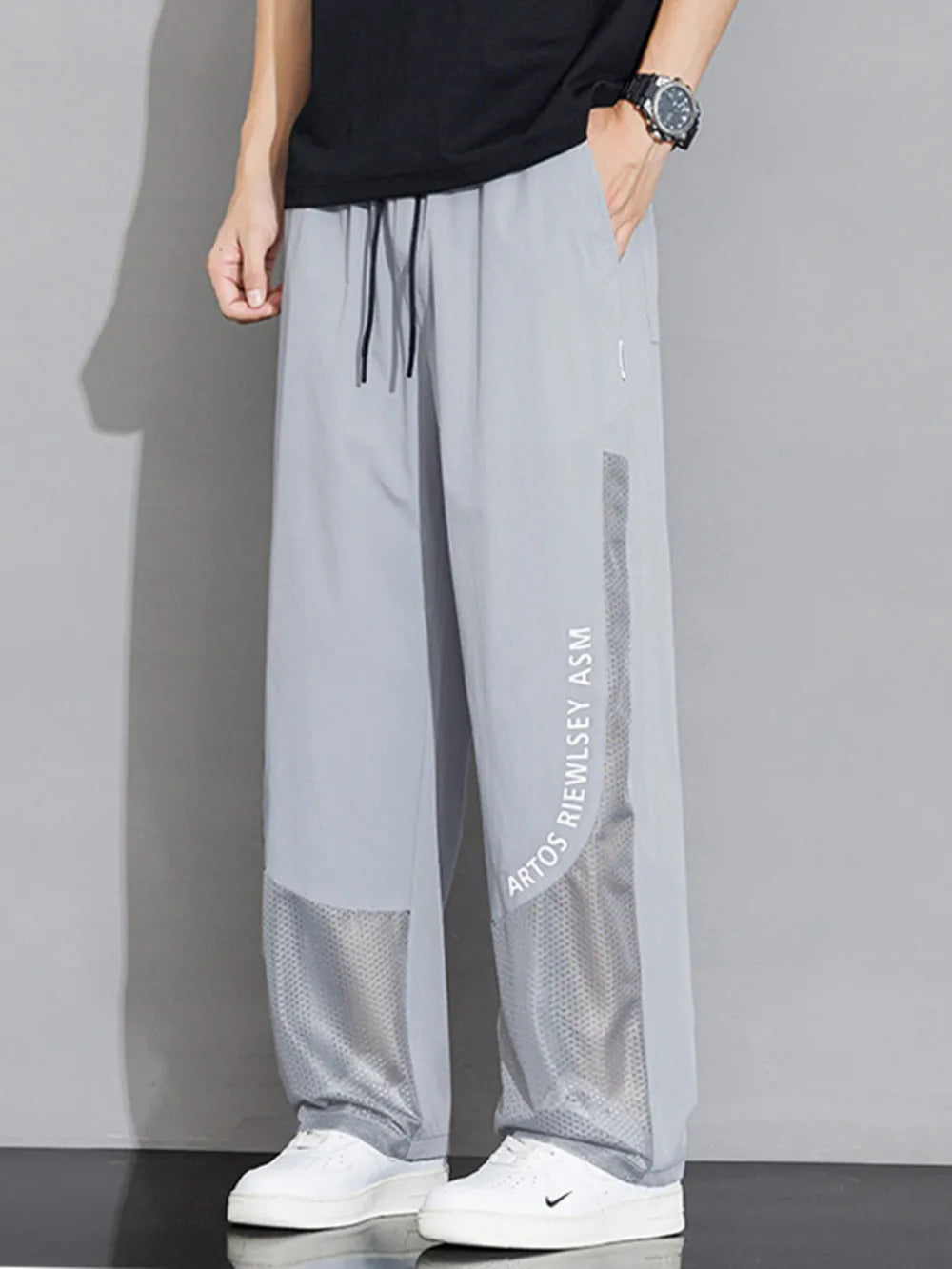 Light Gray mesh panel wide-leg sweatpants with drawstring and text detail.