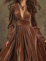 Dark brown velvet maxi dress with voluminous sleeves and plunging neckline