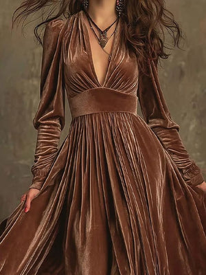 Dark brown velvet maxi dress with voluminous sleeves and plunging neckline