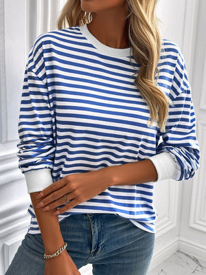 Horizontal stripe crewneck sweatshirt in royal blue and white with white cuffs.