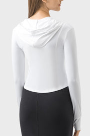 White active hoodie with thumbholes and a fitted silhouette.
