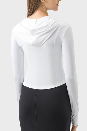 White active hoodie with thumbholes and a fitted silhouette.