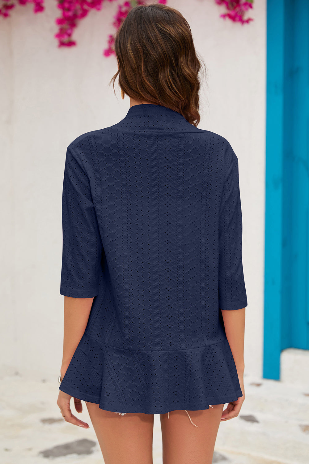 Dark Blue perforated ruffle hem cardigan with 3/4 sleeves and a collared neckline.