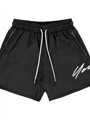 Black BigFit jogger shorts with drawstring and zippered pockets, featuring a white script logo.