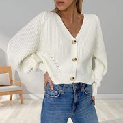 White ribbed knit cardigan with balloon sleeves and gold buttons