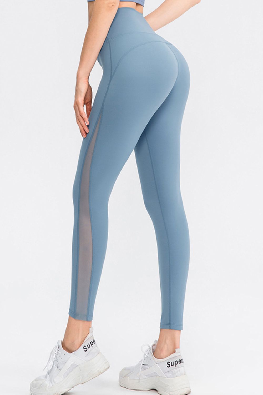 Light blue performance leggings with side mesh panels.
