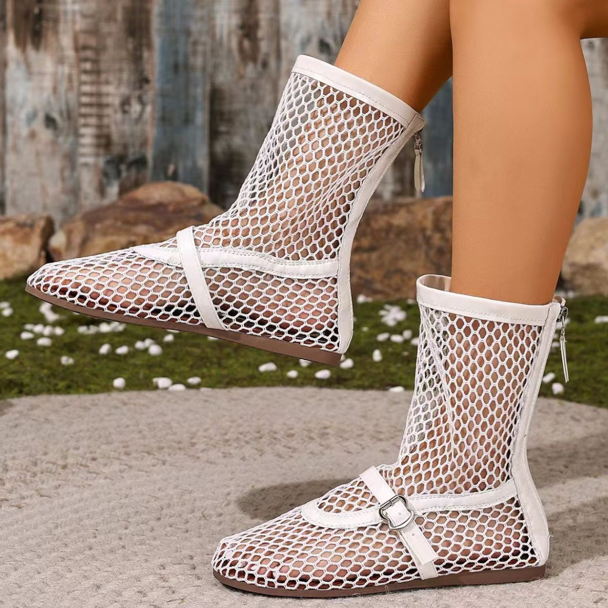 White mesh ankle sandals with buckle detail and zipper closure.