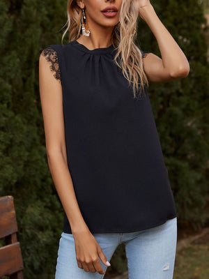 Black shell top with gathered neckline and lace trim sleeves.