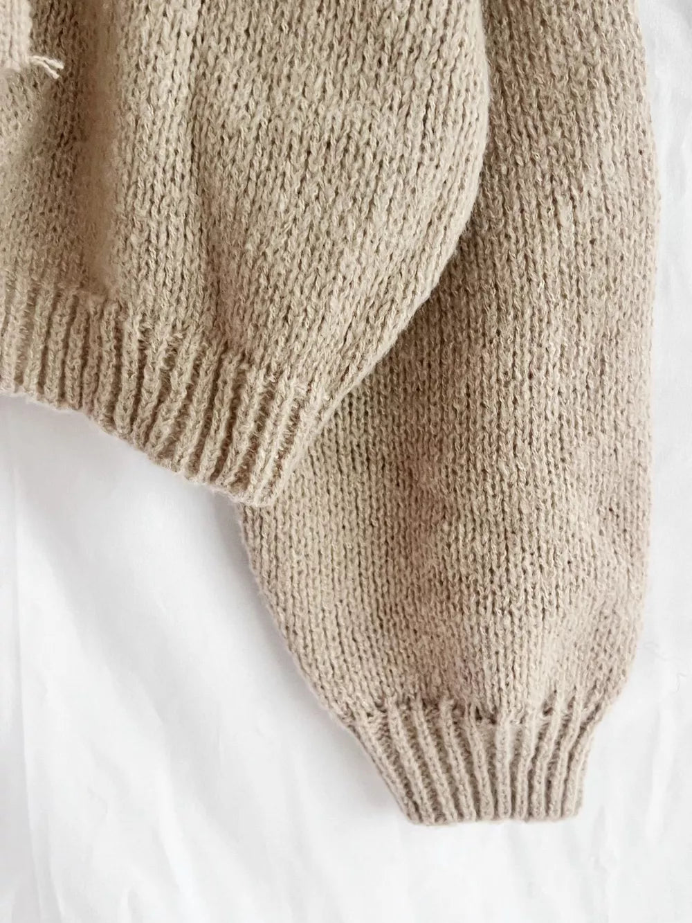 Textured knit cardigan in khaki with ribbed cuffs and hem detail.