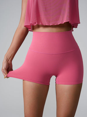 Deep Pink active shorts with high waist and sculpted pocket detail, showing stretch.
