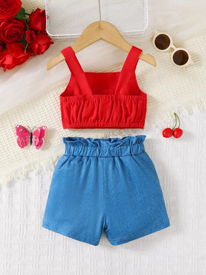 Red ruffled crop top and blue denim shorts set with bow detail.