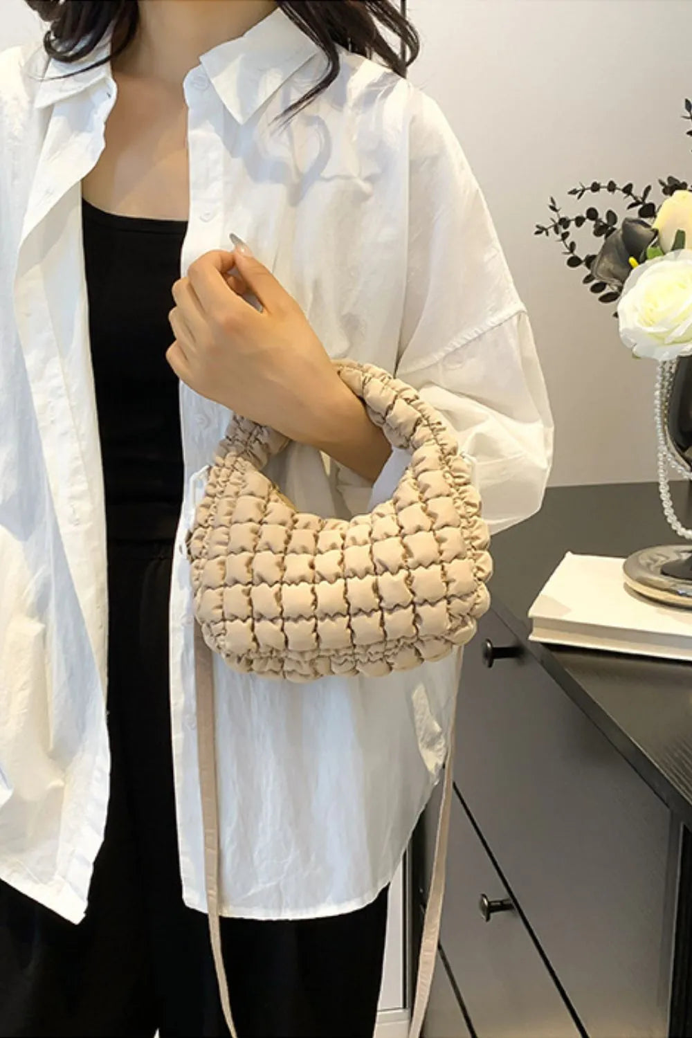 Padded crescent crossbody bag in Khaki with sculptural texture and ruched handle.