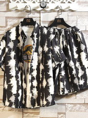 Men's abstract print short-sleeve shirt and drawstring shorts set in black and white.