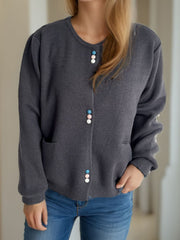Dark Gray ribbed knit cardigan with playful pastel buttons and pockets