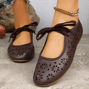 Brown floral cutout slip-on flats with tie detail and ankle bracelet