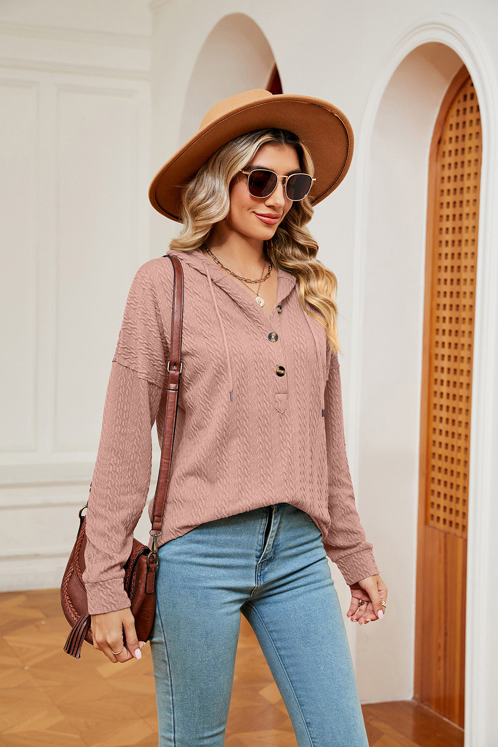Textured henley hoodie in coral with drop shoulder and button neckline.
