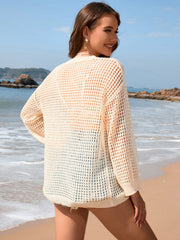 Open-knit beach cover-up in light yellow acrylic, featuring a relaxed fit and long sleeves.