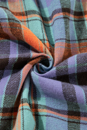 Oversized shacket in orange, purple, and teal plaid fabric with a soft texture.