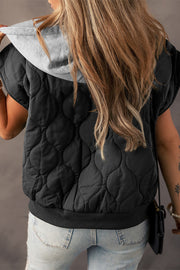 Black quilted hooded sleeveless jacket with grey hood detail and ribbed hem