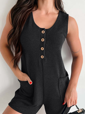 Black textured button-down pocket romper with gold buttons and scoop neck.