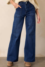 Mid-rise straight leg jeans in dark wash denim with utility pockets and button closure.