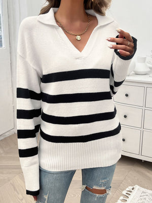 White and black striped knit polo sweater with a v-neck and collar.