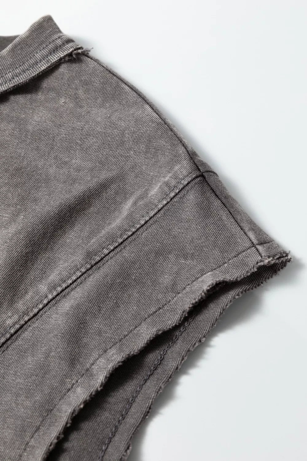 Relaxed mineral wash cotton tank top with raw hem detail.