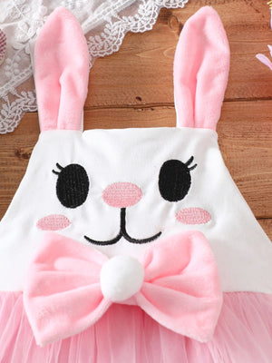 White baby one-piece with embroidered bunny face, pink bow, and pink tulle skirt.