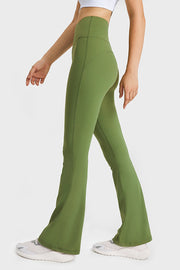 Green flare yoga pants with high waist and breathable fabric.