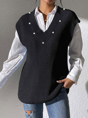 Black ribbed knit sleeveless V-neck vest with pearl embellishments.