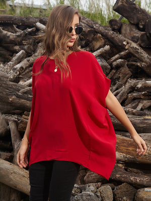 White draped asymmetrical sleeve blouse, casual, adult.