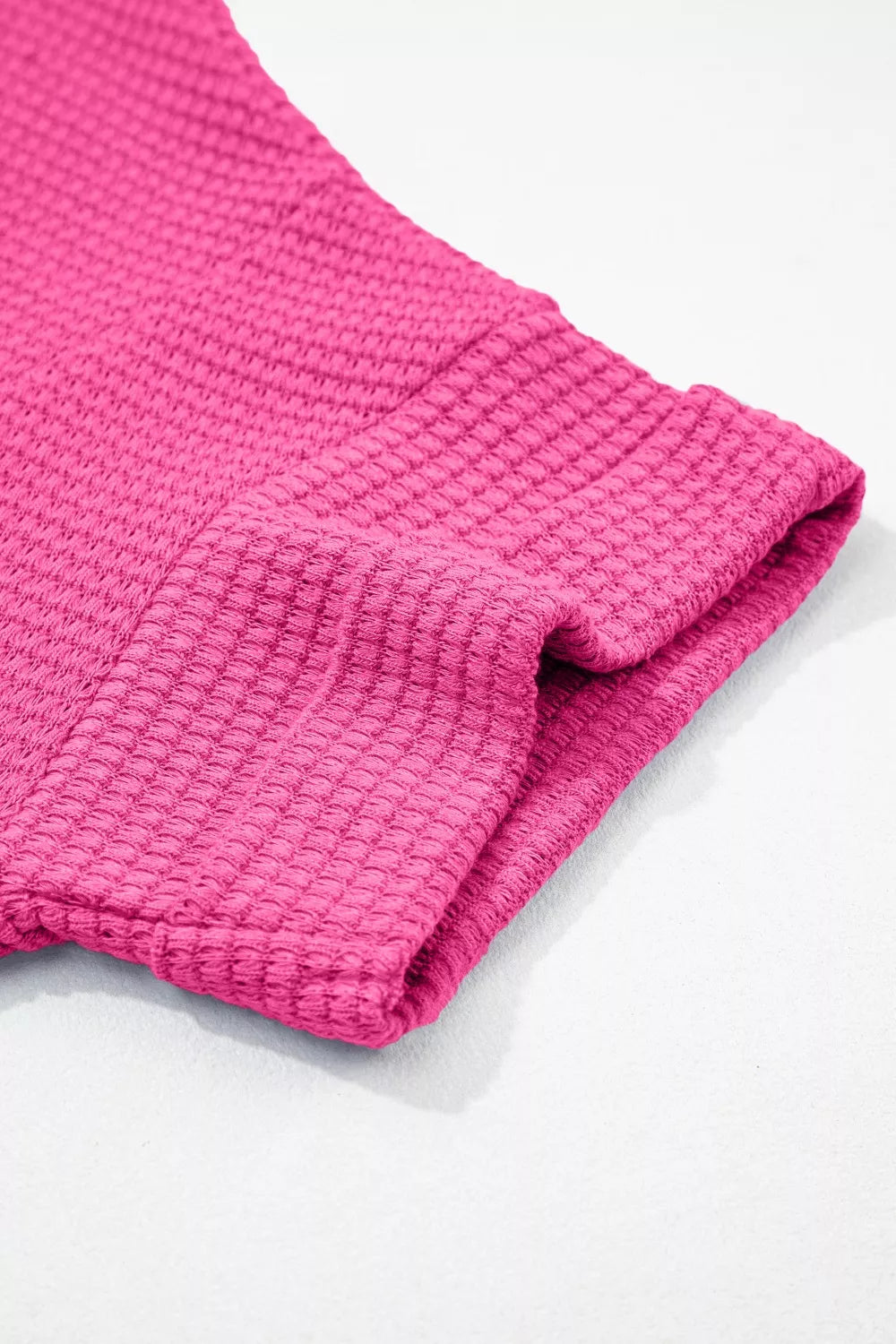 Hot pink waffle knit V-neck t-shirt with textured fabric detail