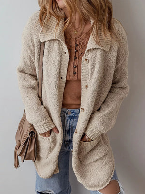 Beige textured button-up cardigan with pockets and a collared neckline.