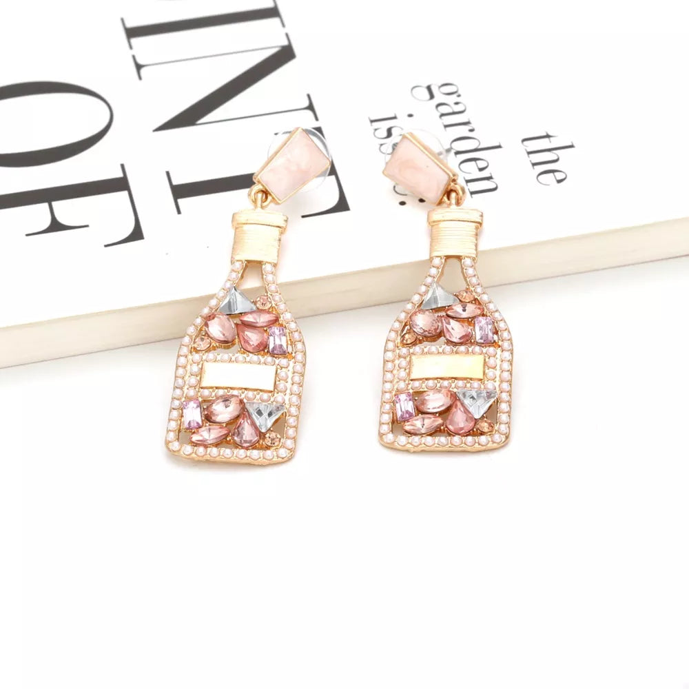 Champagne bottle drop earrings with pink and clear gems and pearl accents.
