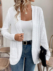 White open-weave embroidered cardigan with pockets, open front, and long sleeves.