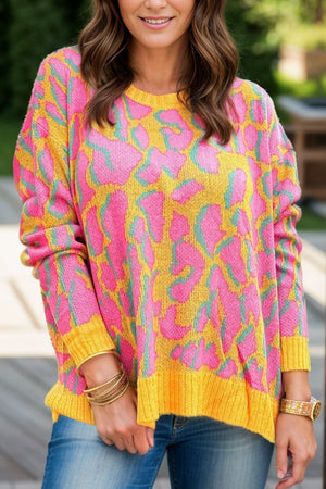 Women's abstract leopard print crew knit sweater in fuchsia pink and yellow with a relaxed fit.