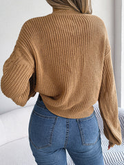 Textured cable knit drop shoulder pullover in taupe with balloon sleeves.