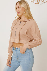 Waffle knit cropped zip hoodie in khaki with drawstring hood and pockets.