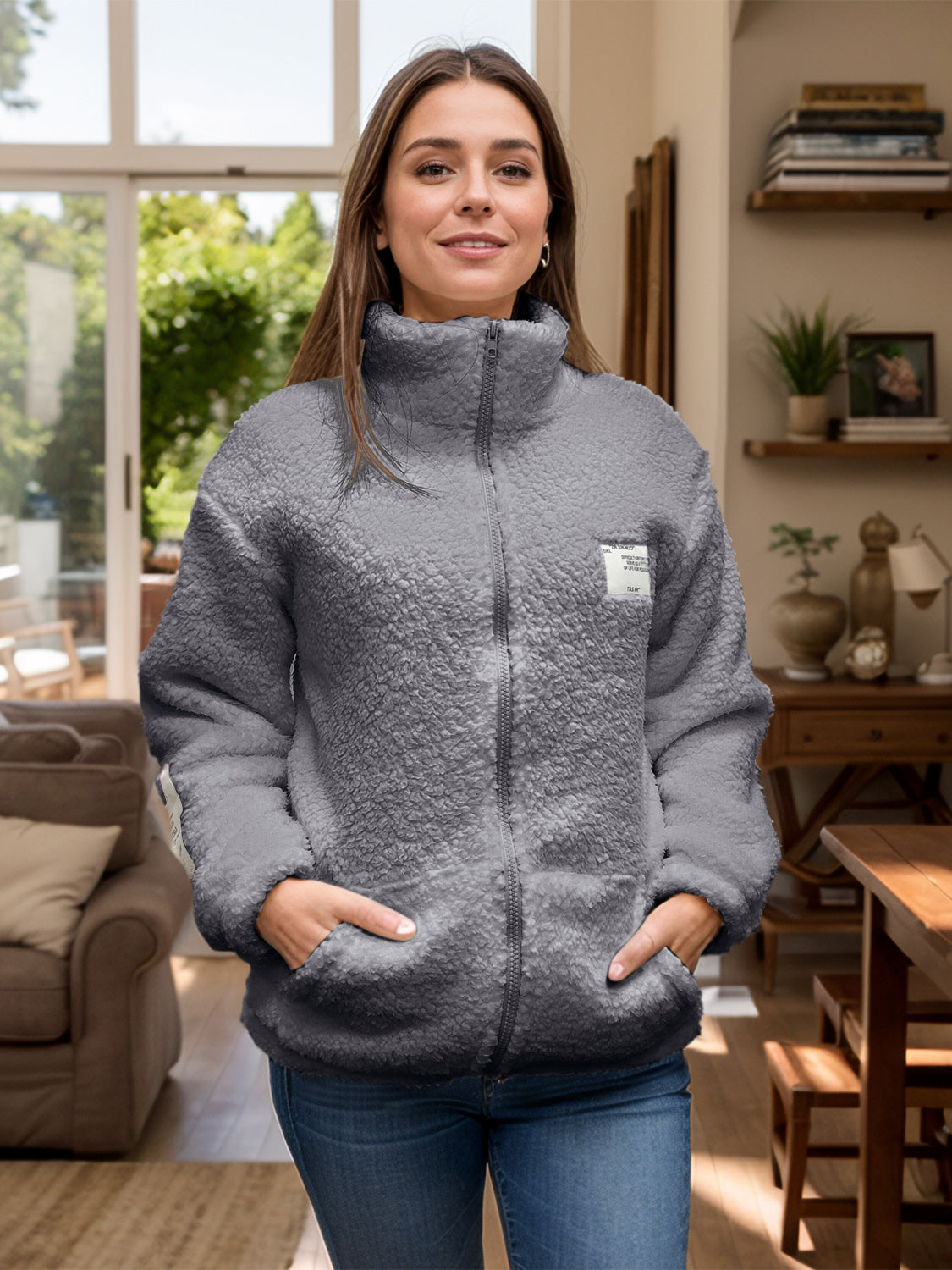 Textured sherpa zip-up jacket in dark gray with stand collar and pockets.
