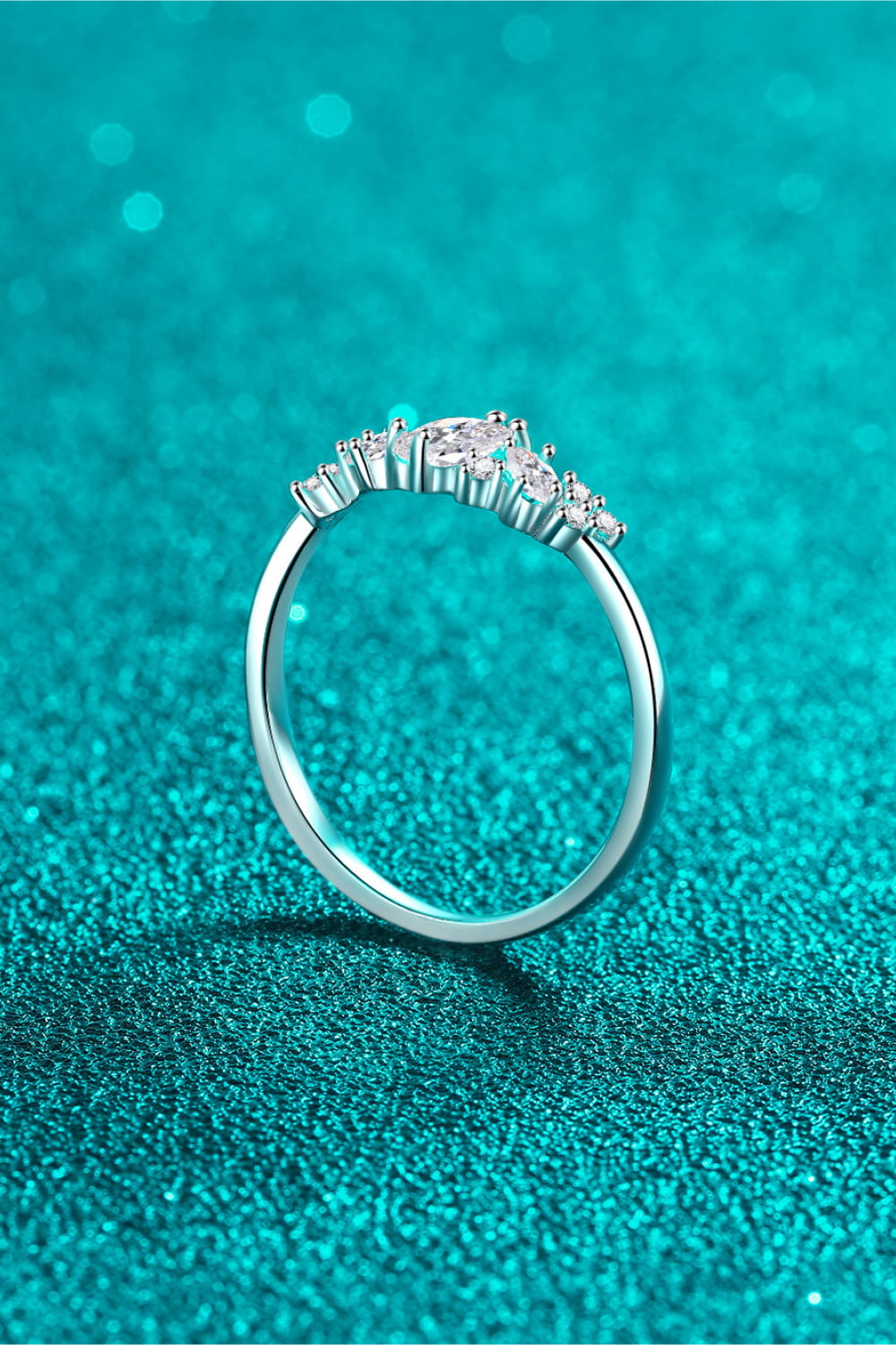 Silver Marquise Cluster Moissanite Ring with sparkling stones.