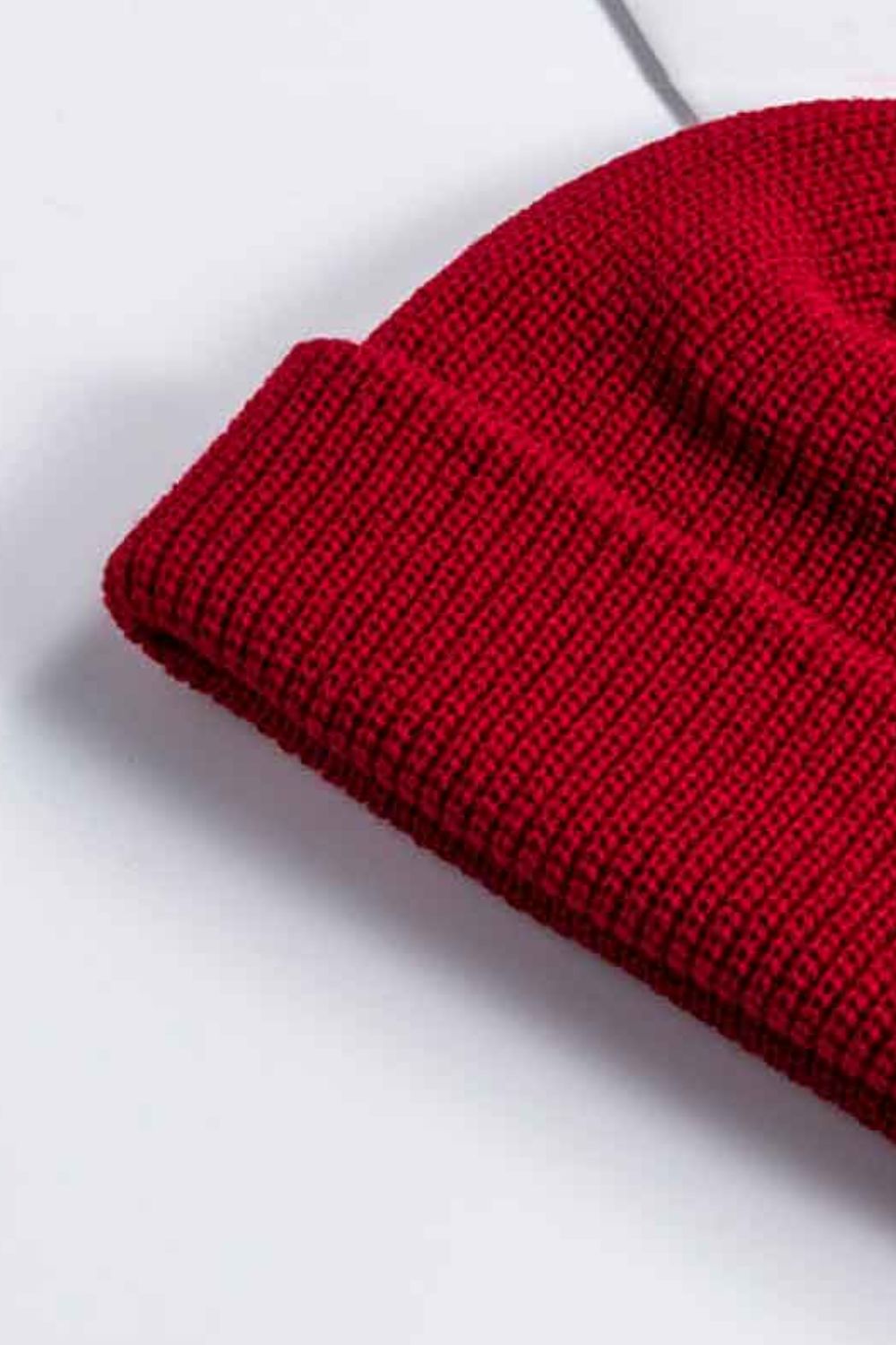 Red ribbed knit beanie with a turn-up cuff