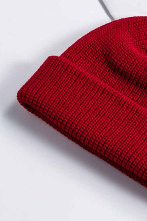 Red ribbed knit beanie with a turn-up cuff