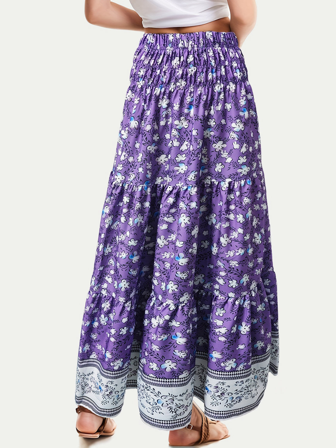 Purple floral maxi tiered skirt with smocked waist and border print hem.
