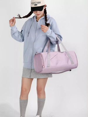 Pastel purple barrel duffle bag with zippered pocket and gray accents, perfect for gym or travel.