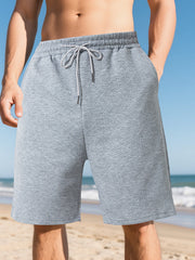 Light gray chino shorts with a geometric pattern and drawstring waist.
