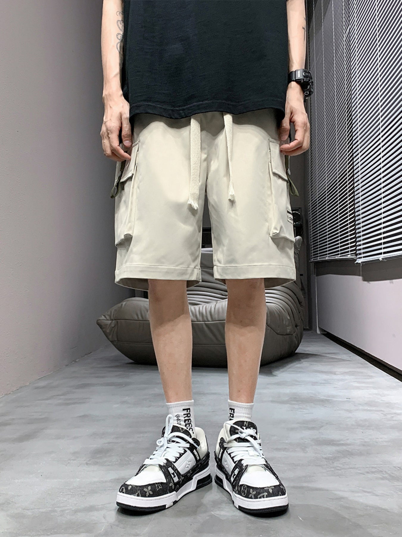 Men's apricot lightweight cargo shorts with drawstring waist and multiple pockets.